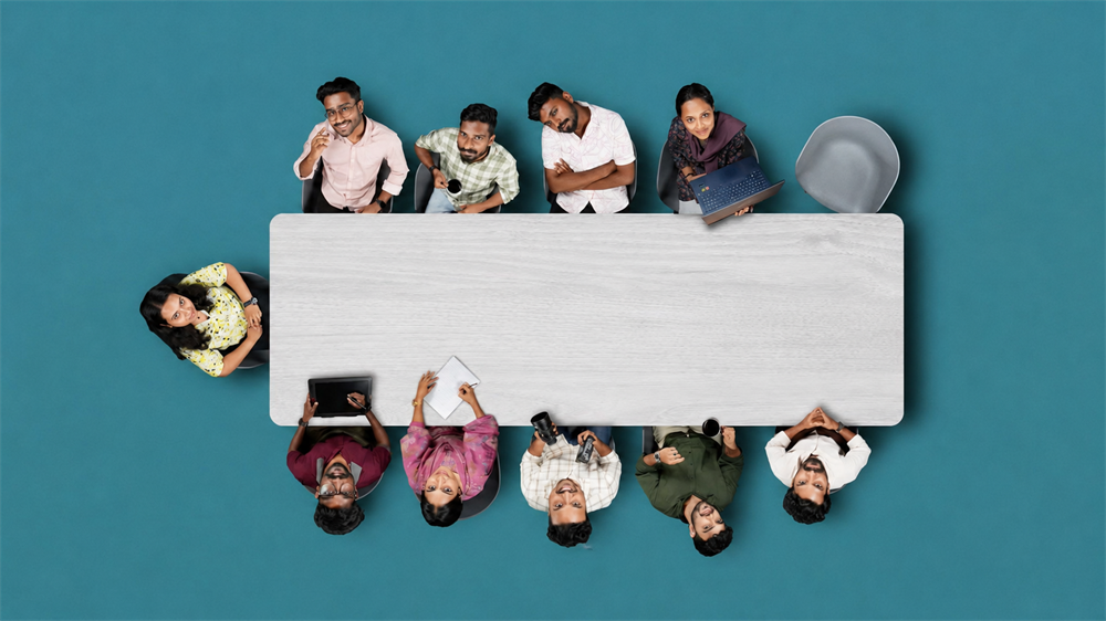 Overhead view of OutSmart community members collaborating around a table